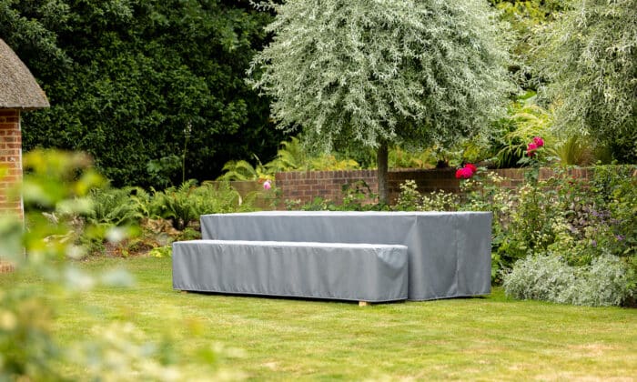 Oxenwood's Large Format Outdoor Table Cover on Table in a grassy garden