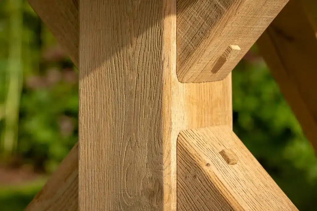 Close up detail of the wooden leg joints of Oxenwood's Aubrey Outdoor Dining Table