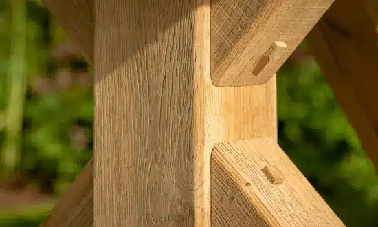 Close up detail of the wooden leg joints of Oxenwood's Aubrey Outdoor Dining Table