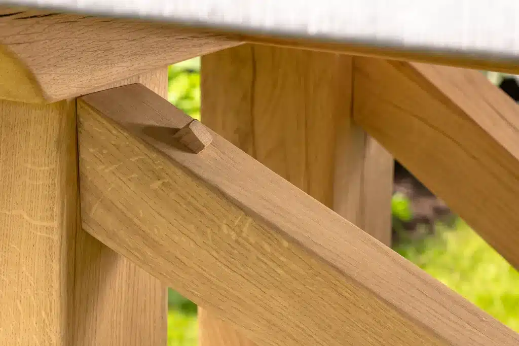 Hagen outdoor dining table close up of oak leg joint