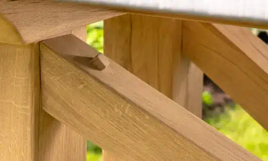 Hagen outdoor dining table close up of oak leg joint