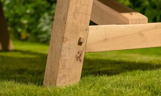 Lucius outdoor dining table - close up of solid oak leg joint