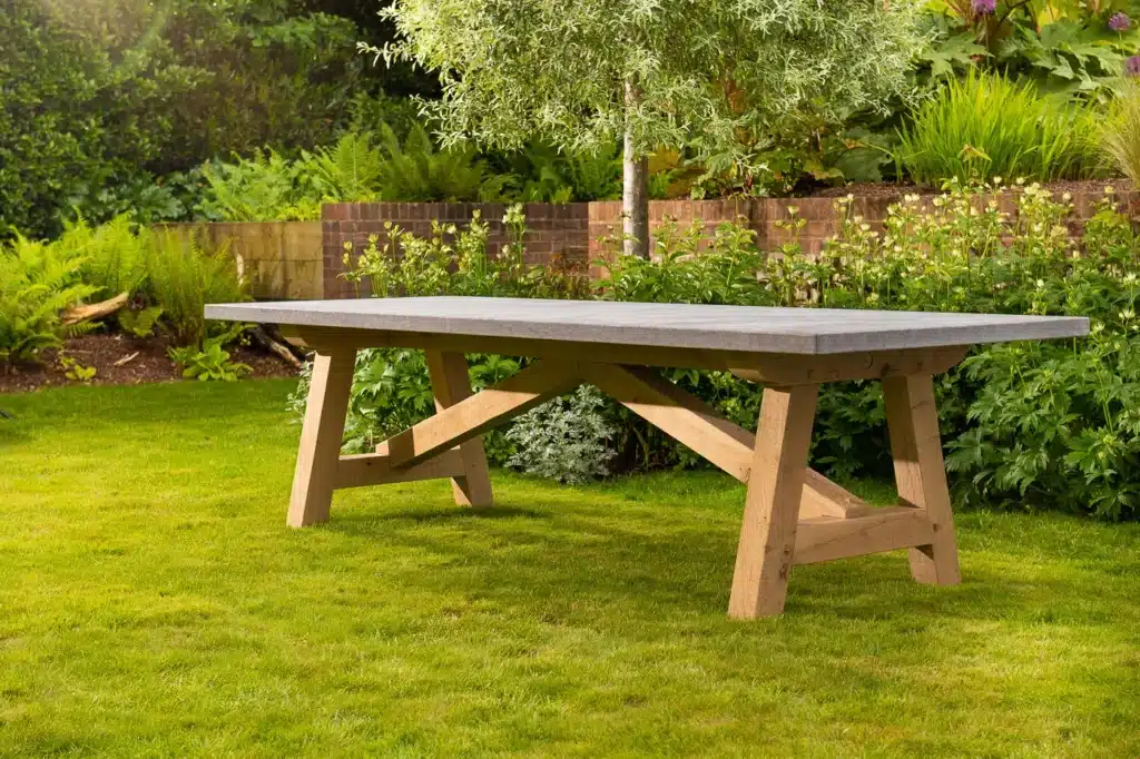 Lucius outdoor dining table side view in outdoor setting