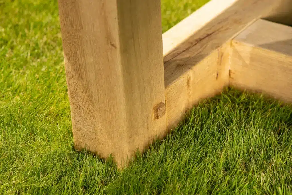 Marcus outdoor dining table oak leg close up
