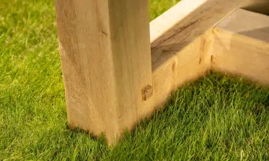 Marcus outdoor dining table oak leg close up