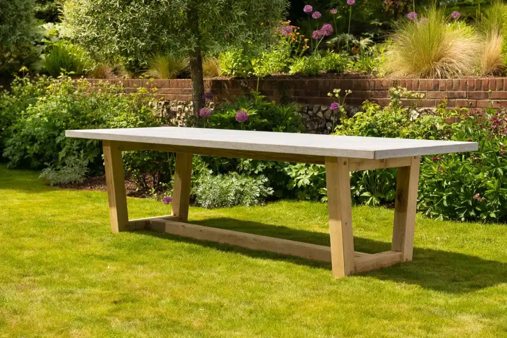 Bluestone topped outdoor dining table in a grassy garden