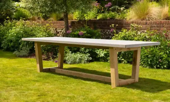 Bluestone topped outdoor dining table in a grassy garden