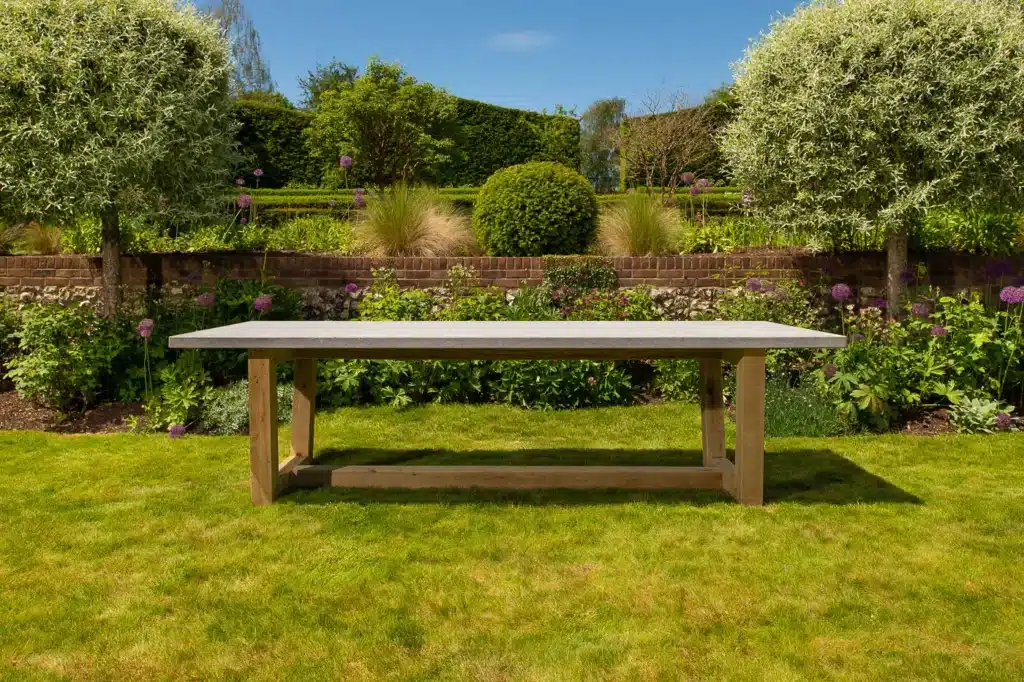 Bluestone topped outdoor dining table in a grassy garden
