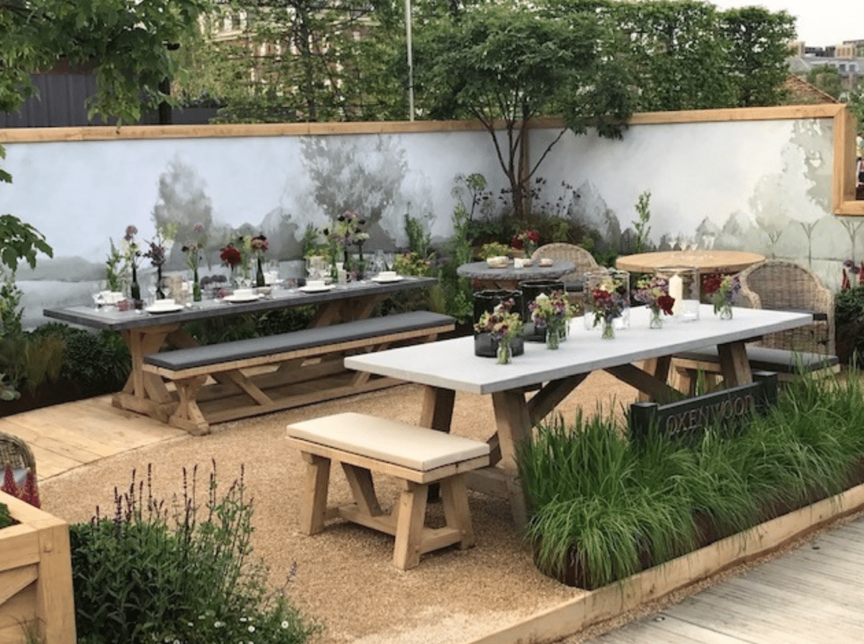 Oxenwood's Decorated and Placed Dining Table and Benches at Chelsea Flower Show 2019